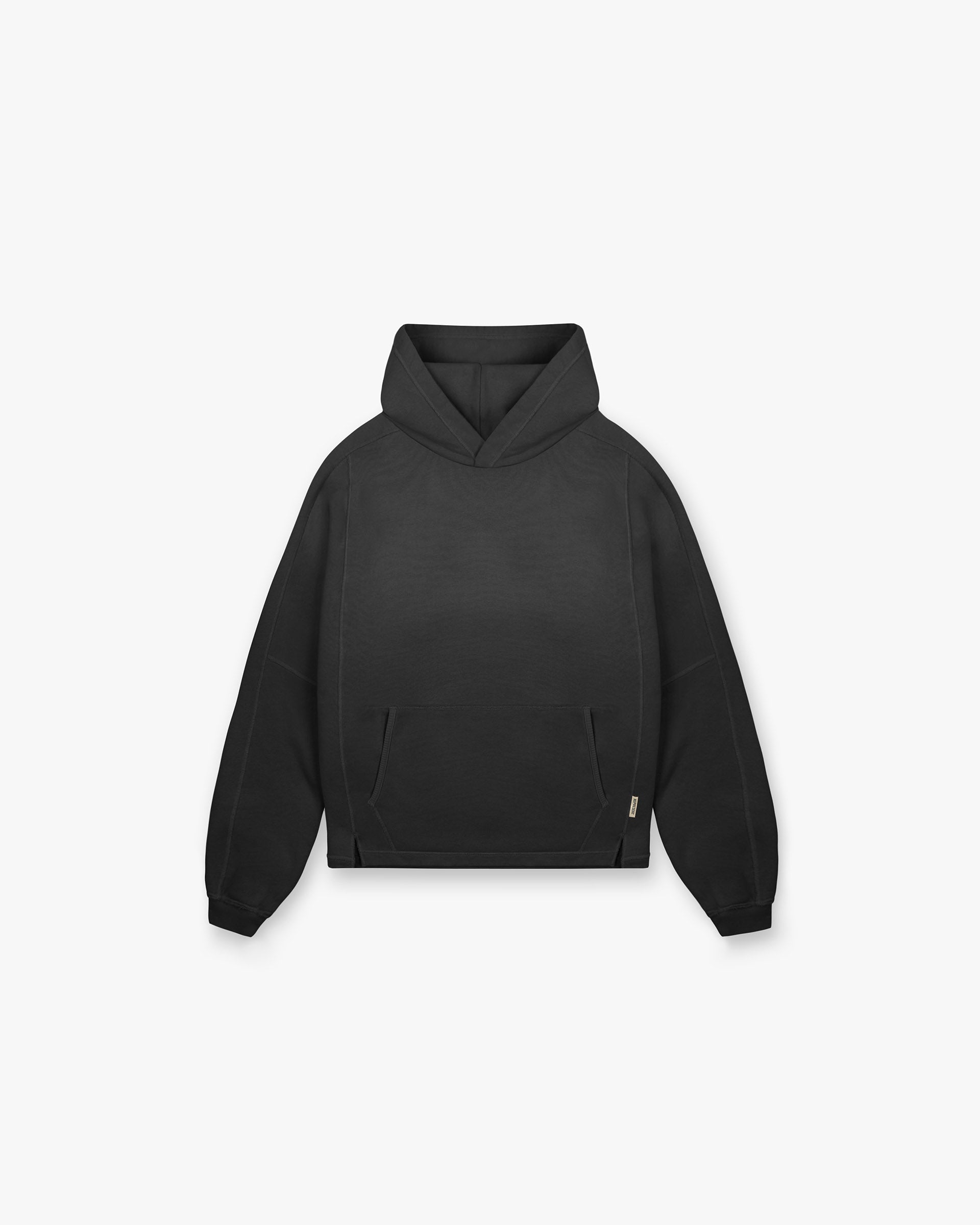 Front product image of a kids black hoodie on a plain white background | Stepped Hem Hoodie in Stained Black | Oversized hoodie with screen printed graphic | FW24 Hoodies | Represent Clo