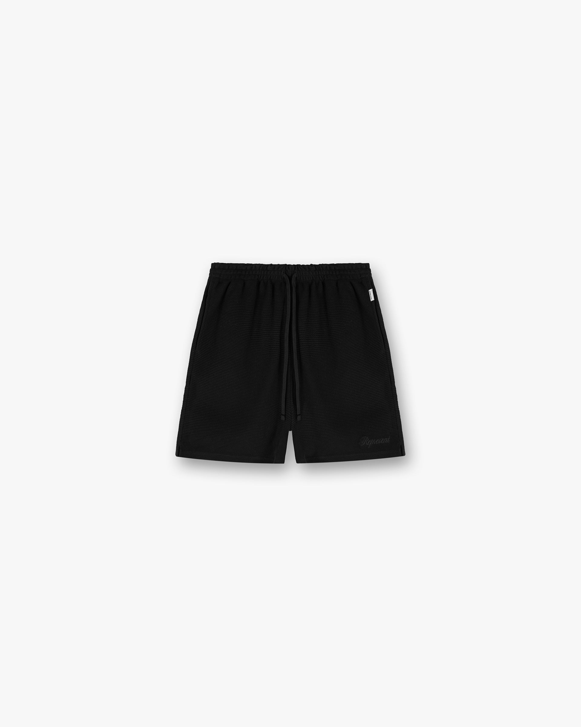 Front product image of mens black shorts on a plain white background | Waffle Shorts in Black | Boxy boyfriend silhouette shorts | SS25 Shorts | Represent Clo