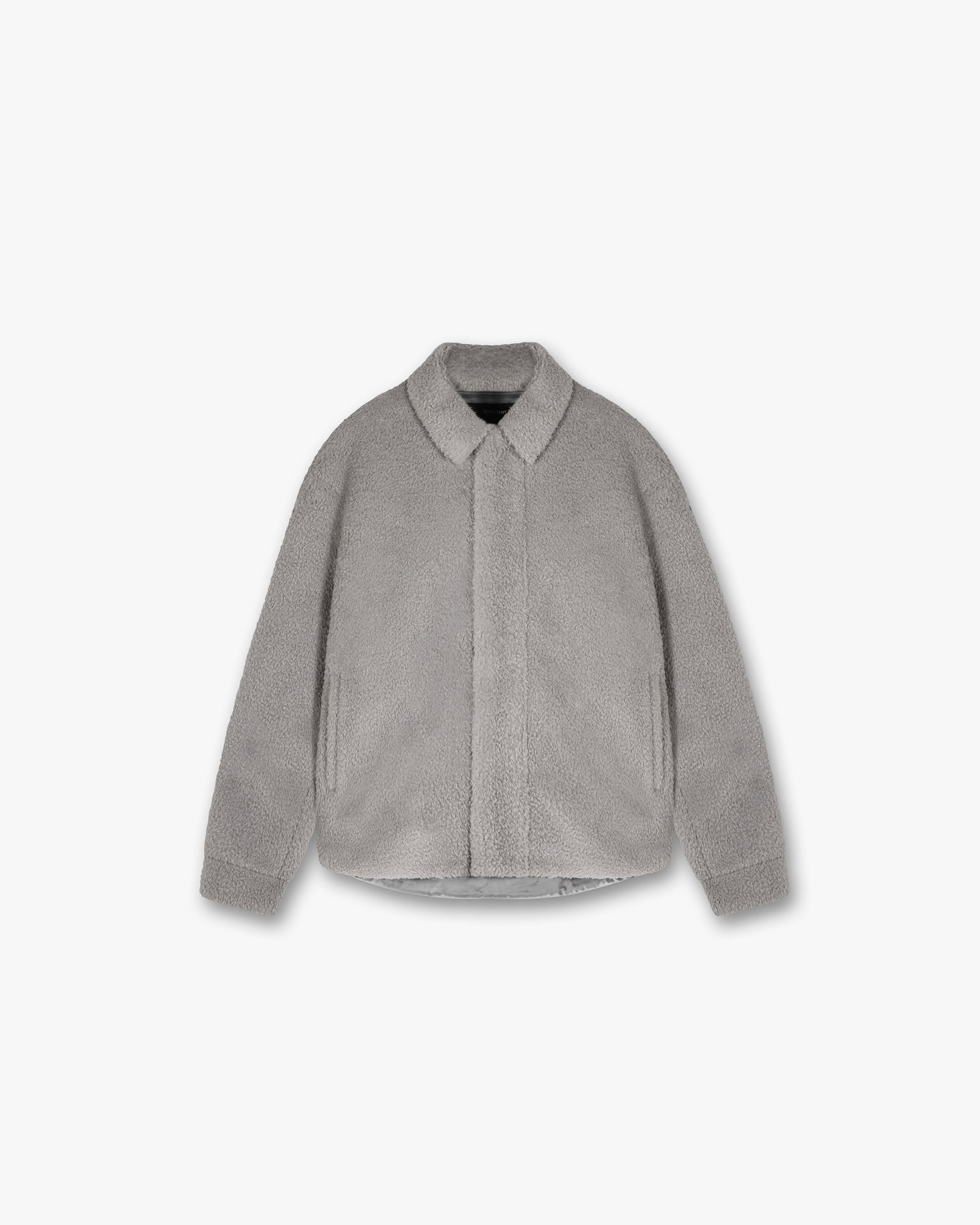 Front product image of a mens grey shirt on a plain white background | Shearling Scoop Hem Shirt in Ice Grey | Shearling shirt with scoop hem design | PRE SS24 Shirts | Represent Clo