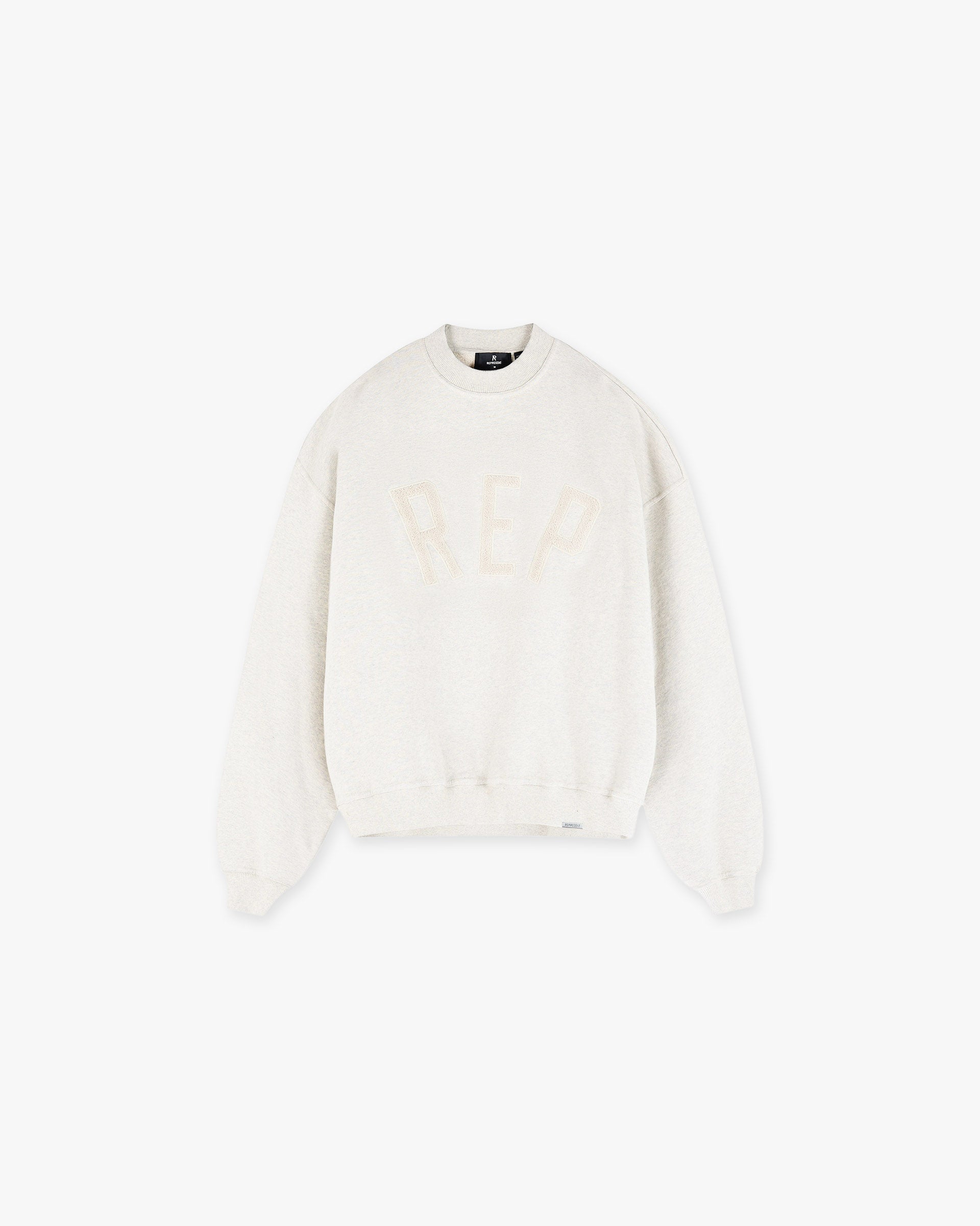 Front product image of a mens cream sweater on a plain white background | Rep Applique Sweater in Cream Marl | Applique detailed sweater | SS25 Sweaters | Represent Clo